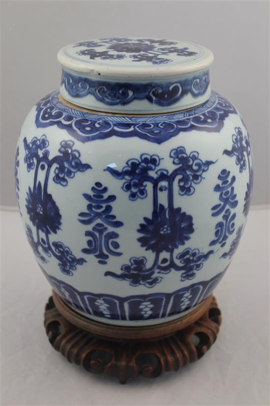 A Chinese blue and white ovoid jar and cover, 19th century, 22.5cm, wood stand